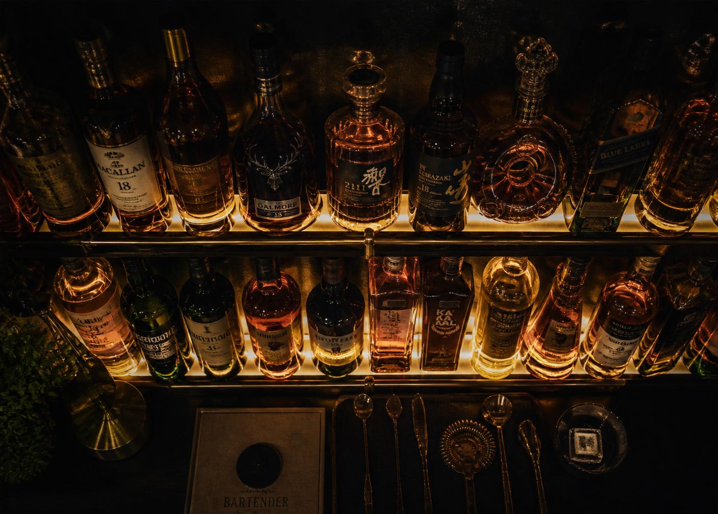 Backlit shelf of premium spirit bottles